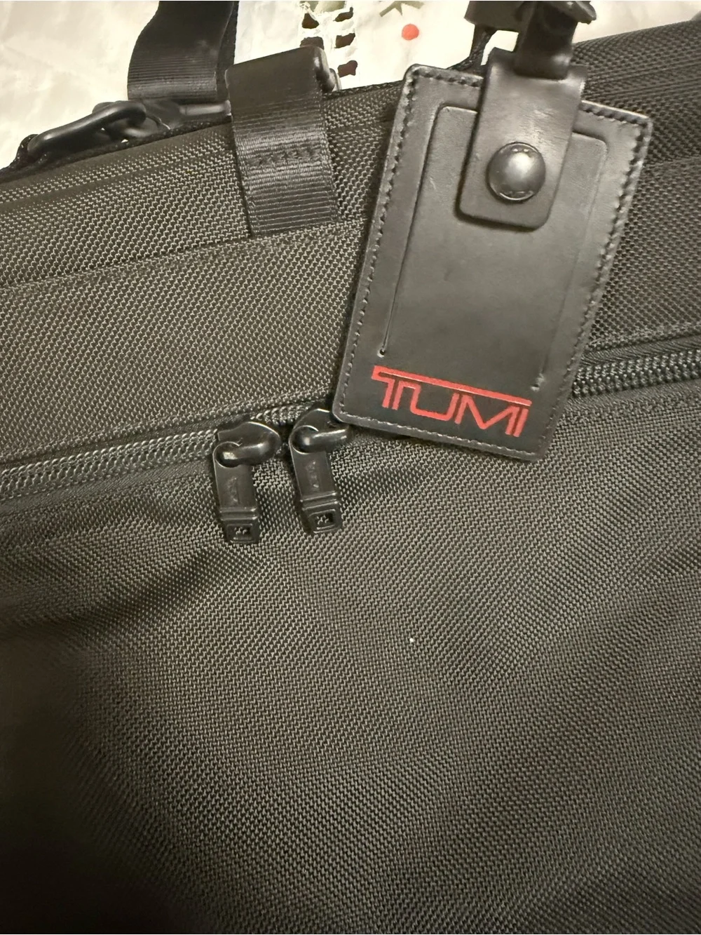 Tumi Black Roll-Top Briefcase with Red Logo Tag